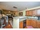 Spacious kitchen area flows into dining room with hardwood flooring at 8652 Grassy Oak Trl, North Charleston, SC 29420