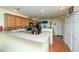 Functional kitchen design with breakfast bar and oak cabinets at 8652 Grassy Oak Trl, North Charleston, SC 29420