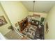 An airy view of a living room boasts vaulted ceilings and comfortable brown sofas, seen from above at 8652 Grassy Oak Trl, North Charleston, SC 29420