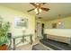 Upstairs loft area with casual seating, glass table, and decorative plant at 8652 Grassy Oak Trl, North Charleston, SC 29420