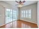 Cozy dining area with hardwood floors, a ceiling fan and sliding glass door with backyard view at 9379 Harroway Rd, Summerville, SC 29485