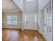 Elegant foyer with hardwood floors, a front door, and French doors to the side at 9379 Harroway Rd, Summerville, SC 29485