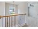 A hallway with carpet flooring leads into a bedroom with a ceiling fan at 9379 Harroway Rd, Summerville, SC 29485