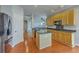 Open kitchen with granite countertops, kitchen island, and stainless steel appliances at 9379 Harroway Rd, Summerville, SC 29485