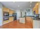 Updated kitchen features granite countertops, island, stainless appliances, and hardwood floors at 9379 Harroway Rd, Summerville, SC 29485