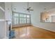 Open living room featuring hardwood floors, fireplace, and lots of natural light at 9379 Harroway Rd, Summerville, SC 29485