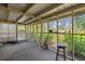 Screened porch with view of backyard at 1019 Levi Lake Rd, Johns Island, SC 29455