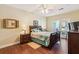 Bedroom with hardwood floors, balcony access, and a dark wooden dresser and headboard at 1025 Riverland Woods Pl # 1008, Charleston, SC 29412