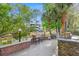 Outdoor kitchen area with built-in grill and scenic pond views, ideal for outdoor dining and relaxation at 1025 Riverland Woods Pl # 1008, Charleston, SC 29412