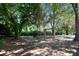 Outdoor grill area with mature trees, perfect for community gatherings and barbecues at 1025 Riverland Woods Pl # 1008, Charleston, SC 29412