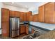 Modern kitchen with stainless steel appliances, stone counters, and ample cabinet space at 1025 Riverland Woods Pl # 1008, Charleston, SC 29412