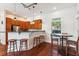 Charming kitchen with rich wood cabinetry, modern fixtures, and bar seating at 1025 Riverland Woods Pl # 1008, Charleston, SC 29412