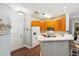 Bright kitchen with white countertops, stainless appliances, wood cabinets and breakfast bar at 1025 Riverland Woods Pl # 1008, Charleston, SC 29412