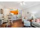 Open-concept living area with a view of the kitchen and comfortable seating at 1025 Riverland Woods Pl # 1008, Charleston, SC 29412