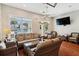 Inviting living area with comfortable wicker furniture and a view of the outdoor pool at 1025 Riverland Woods Pl # 1008, Charleston, SC 29412