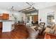 Spacious living room with a glass garage door and stylish wicker furniture arrangement at 1025 Riverland Woods Pl # 1008, Charleston, SC 29412