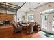 Well-lit sitting area with wicker furniture and glass door access, offering comfort and style at 1025 Riverland Woods Pl # 1008, Charleston, SC 29412