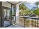 Open patio showcasing tropical landscaping, palm trees, and outdoor patio with decor at 1025 Riverland Woods Pl # 1008, Charleston, SC 29412