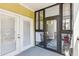 View of enclosed patio featuring bright decor and double door access to main patio at 1025 Riverland Woods Pl # 1008, Charleston, SC 29412