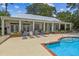 Resort-style pool area with lounge chairs and a clubhouse, perfect for relaxation and entertainment at 1025 Riverland Woods Pl # 1008, Charleston, SC 29412