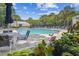 Relaxing pool setting featuring lounge chairs, umbrellas, and manicured landscaping, creating a serene retreat at 1025 Riverland Woods Pl # 1008, Charleston, SC 29412