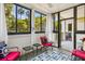 Bright sunroom with a coastal vibe, showcasing large windows and comfortable seating at 1025 Riverland Woods Pl # 1008, Charleston, SC 29412