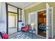 Relaxing sunroom with vibrant decor, opening to a bedroom and a screened outdoor space at 1025 Riverland Woods Pl # 1008, Charleston, SC 29412