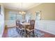 Inviting dining room with a traditional table set and plenty of natural light at 103 Radtko Rd, Summerville, SC 29486
