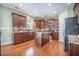 Modern kitchen with an island, stainless appliances, granite countertops, and custom cabinets at 103 Radtko Rd, Summerville, SC 29486