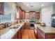 Bright kitchen with stainless appliances, granite counters, and an island perfect for cooking at 103 Radtko Rd, Summerville, SC 29486