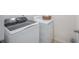Featuring a modern, gray washing machine and white dryer in a dedicated laundry room with neutral walls at 103 Radtko Rd, Summerville, SC 29486