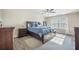Comfortable main bedroom featuring a stylish rug and a beautiful wooden bed frame with drawer storage at 103 Radtko Rd, Summerville, SC 29486