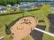 Community playground with swings, slides, and climbing structures in a well-maintained park at 103 Radtko Rd, Summerville, SC 29486