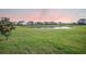 Scenic view of lush green backyard and pond, creating a peaceful and serene setting at 103 Radtko Rd, Summerville, SC 29486