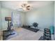 Bright workout room featuring a stationary bike, rowing machine, weight set, and window with natural light at 103 Radtko Rd, Summerville, SC 29486