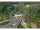 Aerial view of the community entrance, complete with beautiful landscaping and a lake at 1033 Sagegrass St, Summerville, SC 29485