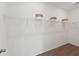 Walk-in closet with wire shelving providing ample storage space with wood floor at 1033 Sagegrass St, Summerville, SC 29485