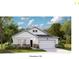 Charming single-story home showcasing a welcoming two-car garage and manicured front yard at 1033 Sagegrass St, Summerville, SC 29485