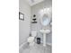 Powder room with pedestal sink, toilet and decorative shelves at 1034 Sterling Ln, Summerville, SC 29483