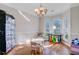 Bright dining room featuring hardwood floors, a chandelier, and multiple windows offering plenty of natural light at 1034 Sterling Ln, Summerville, SC 29483
