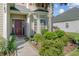 Inviting front entry with a beautiful garden, providing a warm welcome to this charming home at 1034 Sterling Ln, Summerville, SC 29483