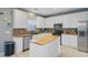 Bright kitchen featuring white cabinetry, stainless steel appliances, and an island with a butcher block countertop at 1034 Sterling Ln, Summerville, SC 29483