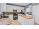 Bright kitchen with stainless appliances, island with butcher block top and white cabinets at 1034 Sterling Ln, Summerville, SC 29483