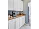 Kitchen nook with upper and lower cabinets, granite counter top, and coffee maker at 1034 Sterling Ln, Summerville, SC 29483