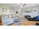Bright living room with hardwood floors, large sectional couch and TV at 1034 Sterling Ln, Summerville, SC 29483