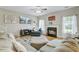 Comfortable living room with fireplace, large sectional couch and ceiling fan at 1034 Sterling Ln, Summerville, SC 29483