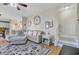 Open-concept living room leading to kitchen and staircase, with hardwood flooring at 1034 Sterling Ln, Summerville, SC 29483