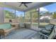 Relaxing screened porch features a ceiling fan, comfortable seating, and views of the private backyard at 1034 Sterling Ln, Summerville, SC 29483