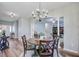 Cozy dining area with dark wood table and views into the living and entryway, creating an inviting atmosphere at 104 Valentin Dr, Summerville, SC 29483