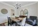 Dining room with modern chandelier, stylish decor, and comfortable seating arrangement at 104 Valentin Dr, Summerville, SC 29483